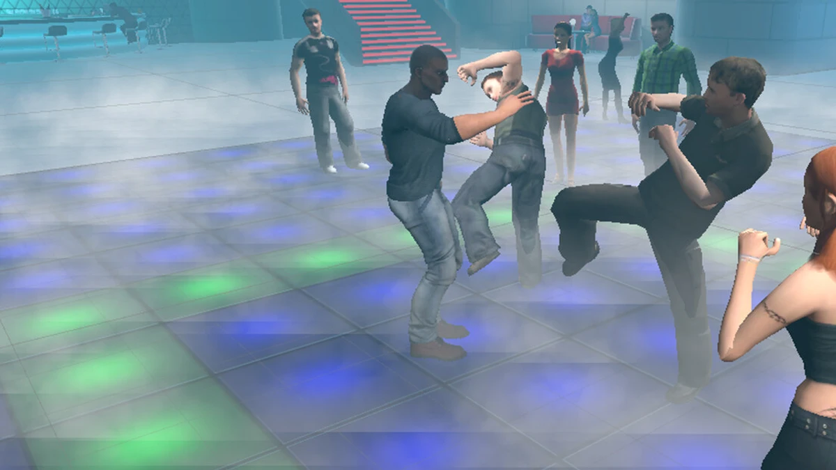People dancing and fighting in a brightly lit nightclub with colorful floor lights.